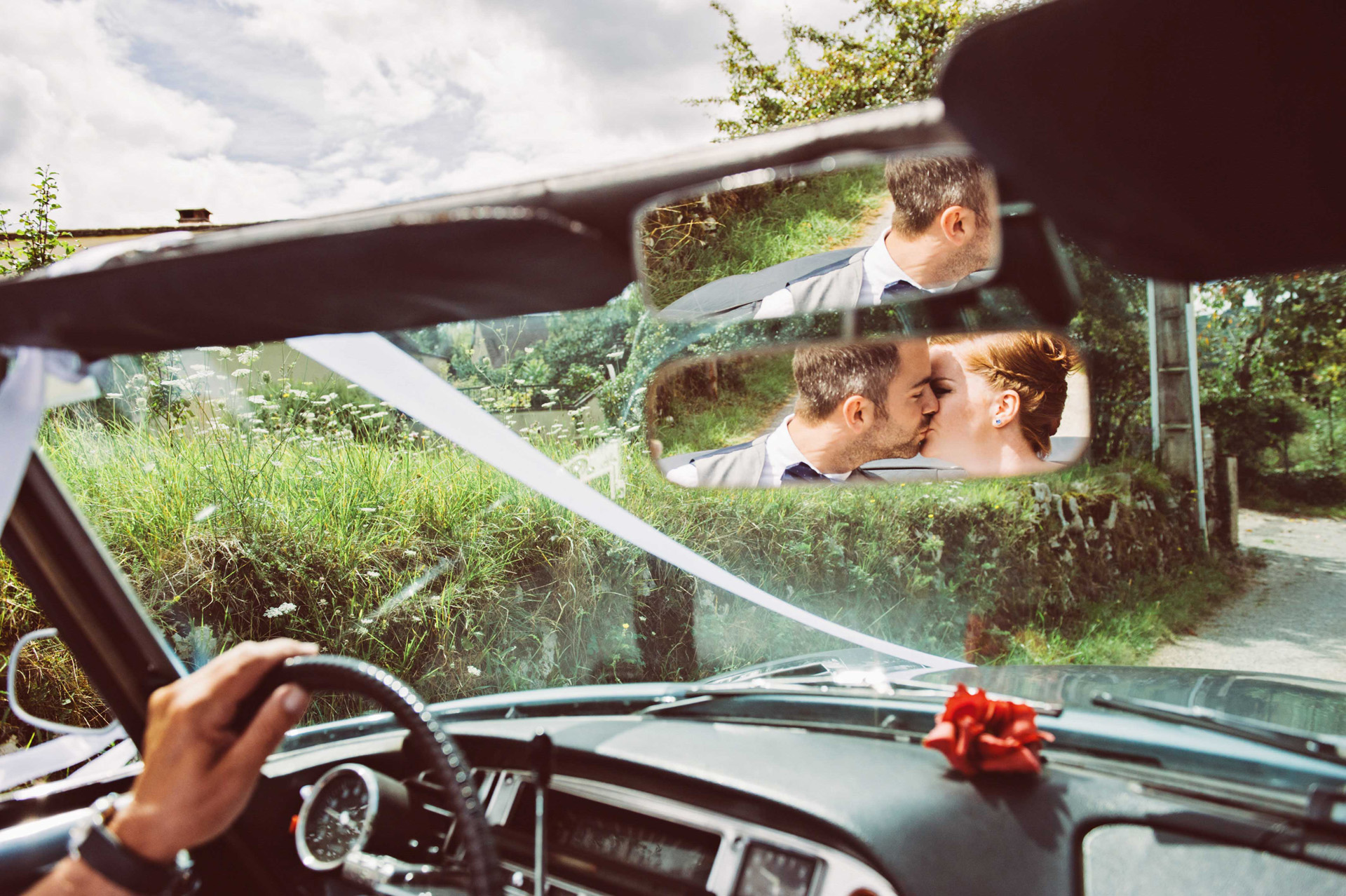 Car driving, couple kissing in mirror, married, wedding, destination wedding, boho wedding