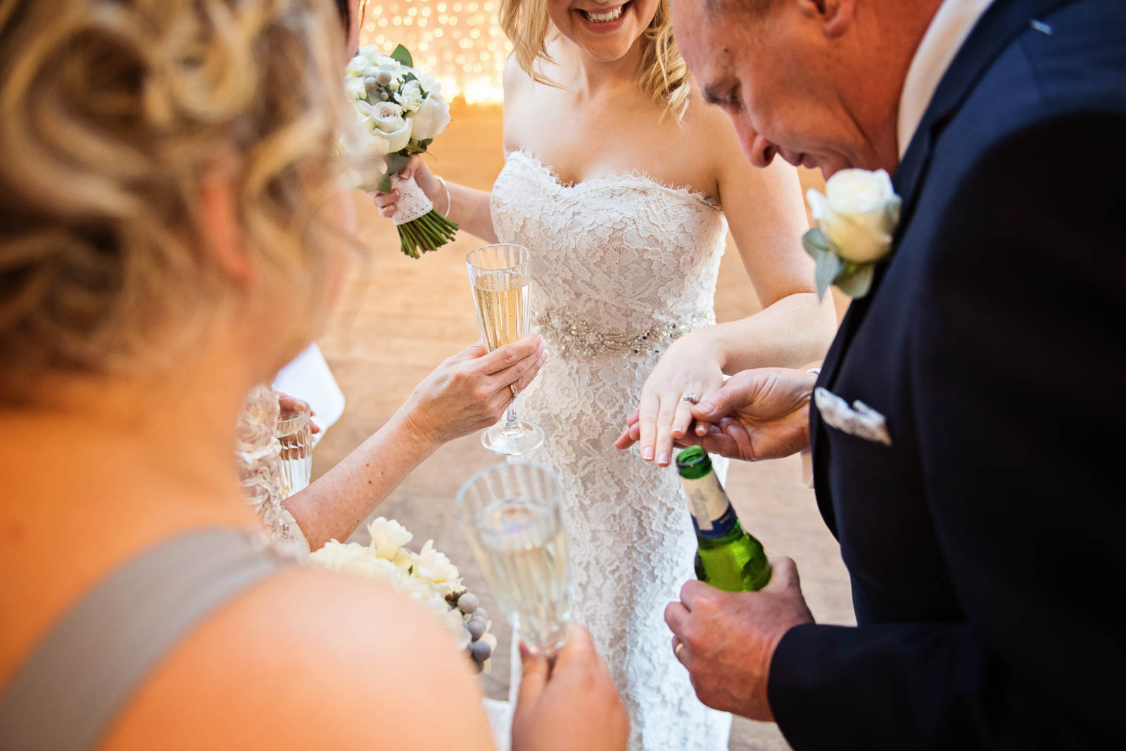 Wedding guests admiring the brides wedding ring.