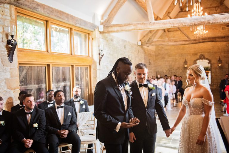 The best man delivering the wedding rings to the bride and groom at Blackwell Grange.