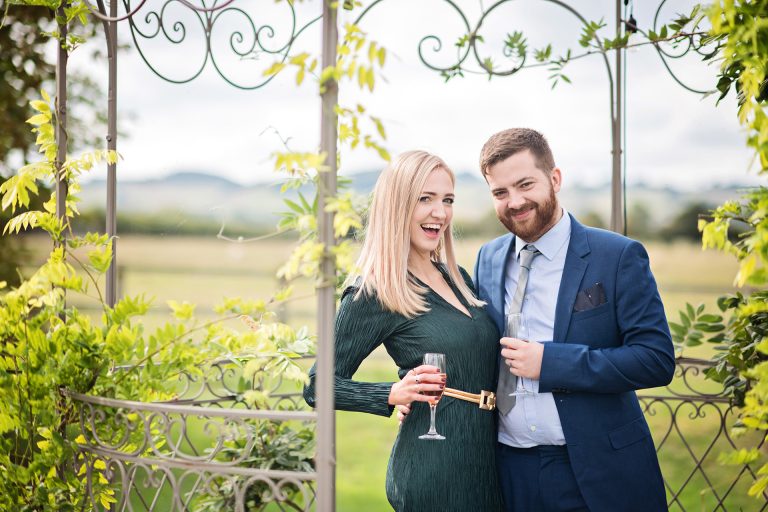 Candid photo by Blooming Photography taken at Blackwell Grange. A couple (male and female) posing to the camera