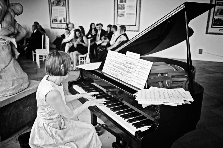 Black & White image of a pianist playing on a grand piano at Margam Country Park.