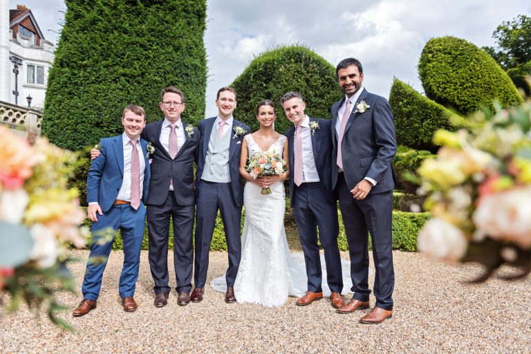 Casual group shot composition by using wedding bouquets. Photographed at Danesfield House Hotel and Spa.