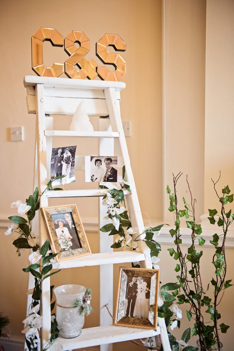 A family photo memory board to those that who are not present but who are in peoples thoughts at the wedding.