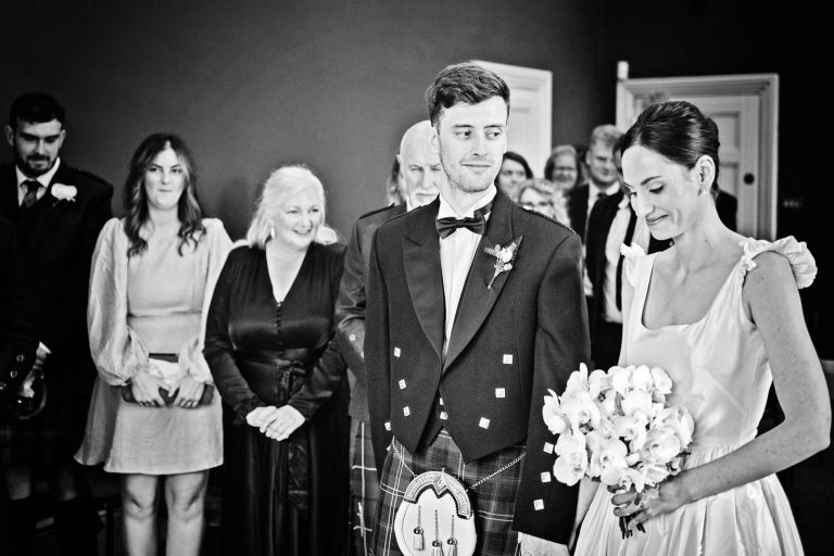 Groom looking admiringly at his bride (black & white photo) Winchester Registry Office Wedding, candid photo by Blooming Photography
