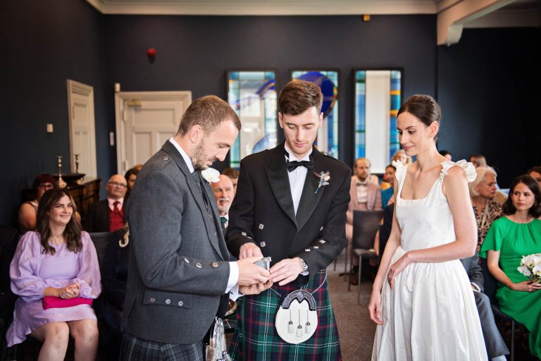 Storytelling wedding photography at Winchester registry office. Photo by Blooming Photography