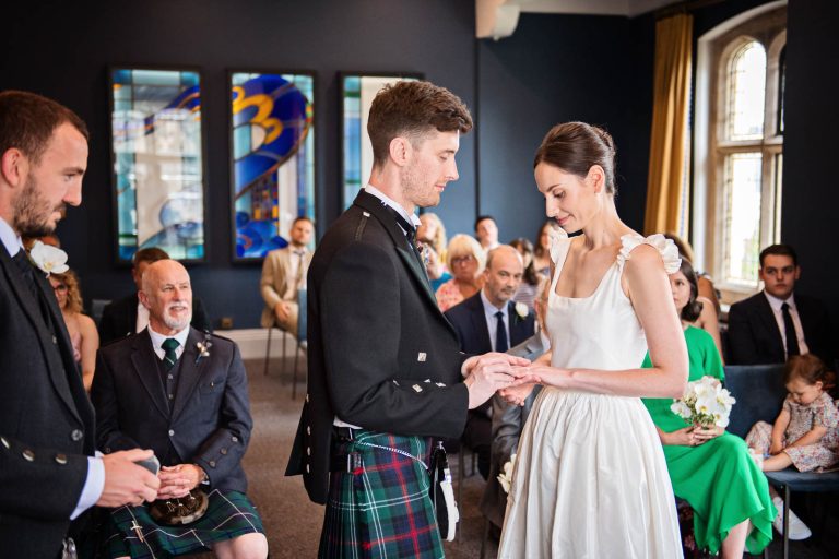 Ring exchange at Winchester registry office. Photo by Blooming Photography