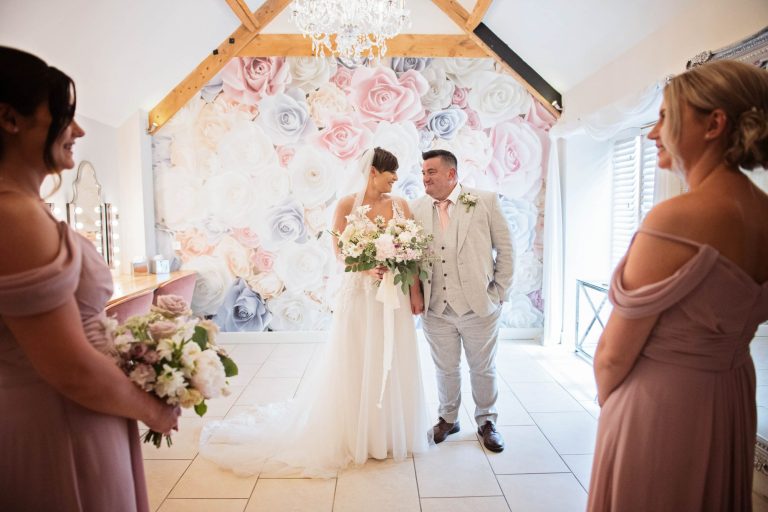 Natural unposed photo of bride and father of bride at Kingscote Barn