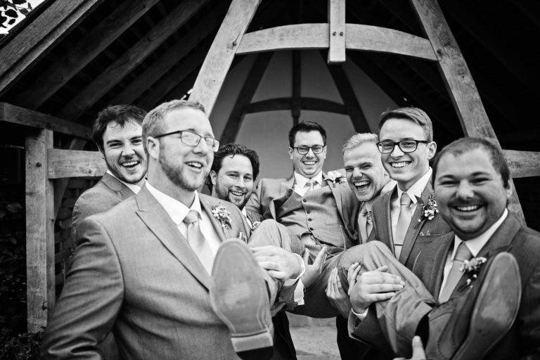 Fun groomsmen photo taken at Kingscote Barn