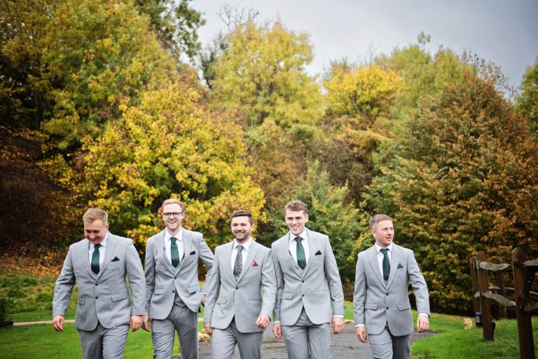 Candid groomsmen photo at Kingscote Barn