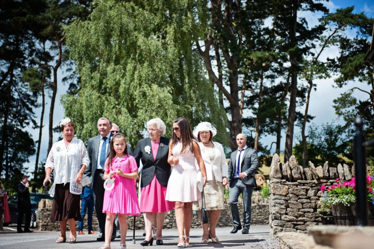 Wedding guests arrive at Kingscote Barn