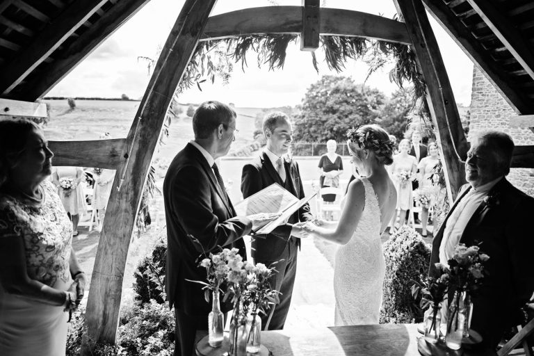 Outdoor wedding ceremony at Kingscote Barn