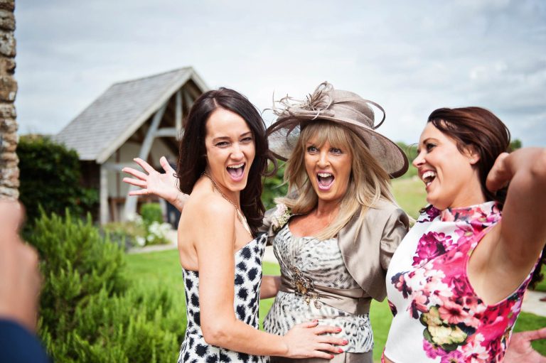 Fun wedding moments taken at Kingscote Barn