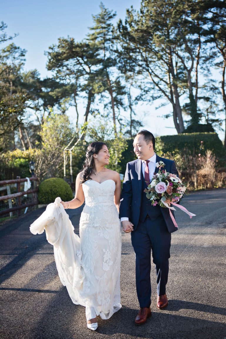 Natural unposed wedding photographs of bride and groom at Kingscote Barn