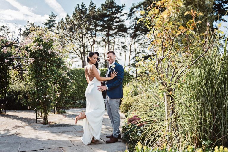 Natural bride and groom photo in gardens at Kingscote Barn