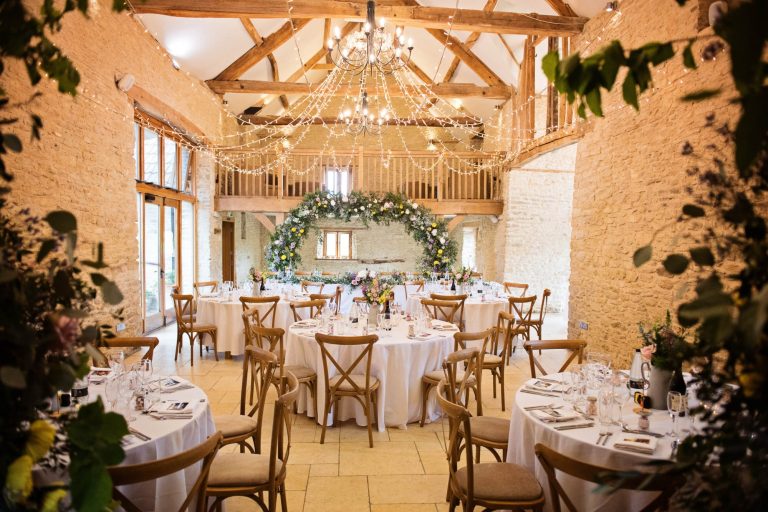 Kingscote Barn wedding breakfast rustic table set up.