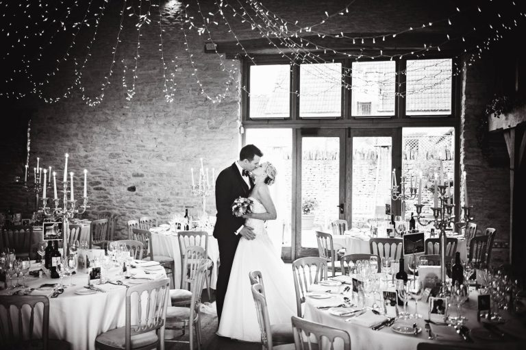 Bride & Groom at Kingscote Barn during wedding breakfast.