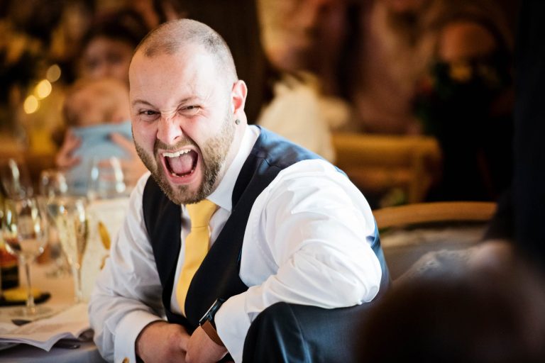 Joyful, fun photo at Kingscote Barn wedding