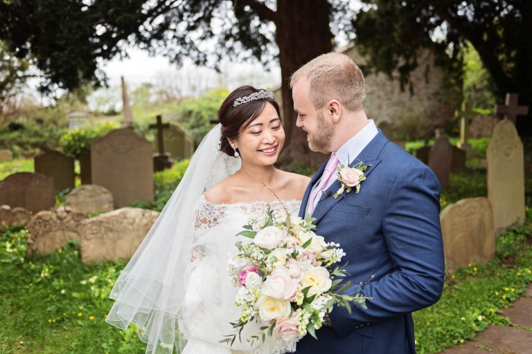 Bride and groom have a moment together. Story telling photograph by Blooming Photography.