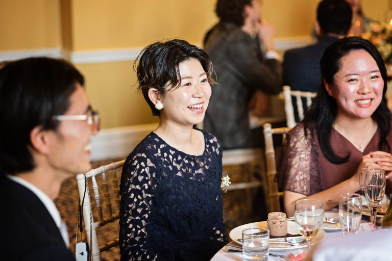 Candid wedding breakfast photo. Photo by Blooming Photography.