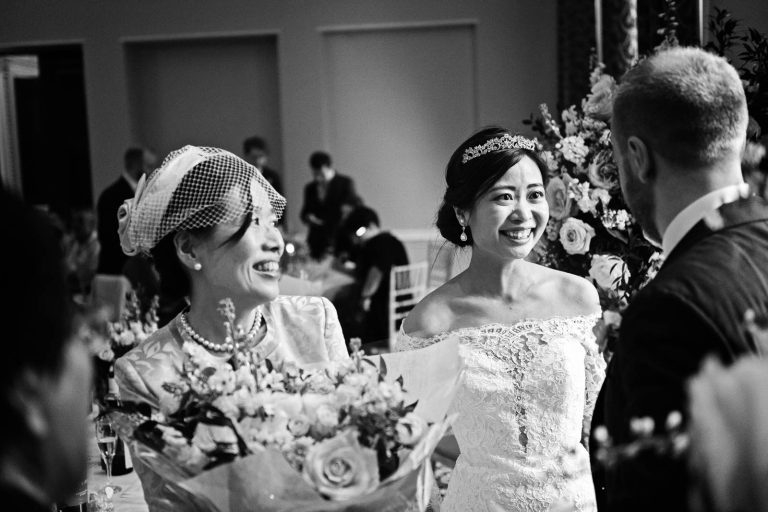 Candid wedding breakfast photo at Leigh Court. Black and white photo by Blooming Photography.