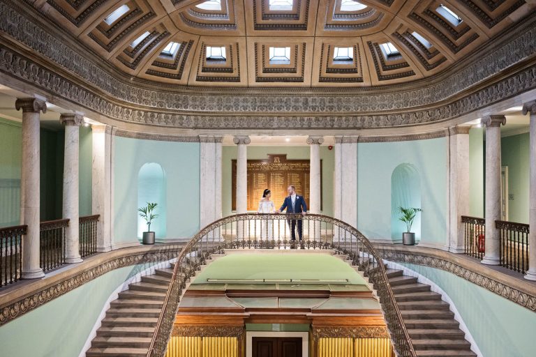Bride and groom in the great hall at Leigh Court, Bristol. Photograph by Blooming Photography