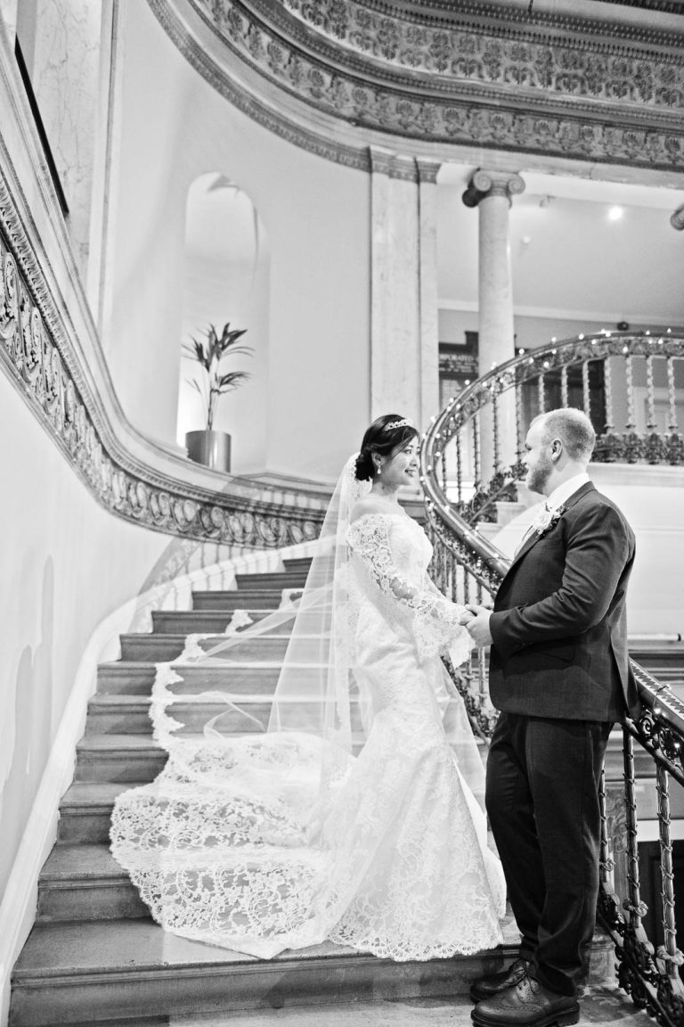 Portrait photo of Bride and groom in the Great Hall at Leigh Court, Bristol. Black and white photograph by Blooming Photography
