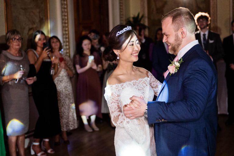 Bride and groom do their first dance in the tapestry room in Leigh Court, Bristol.