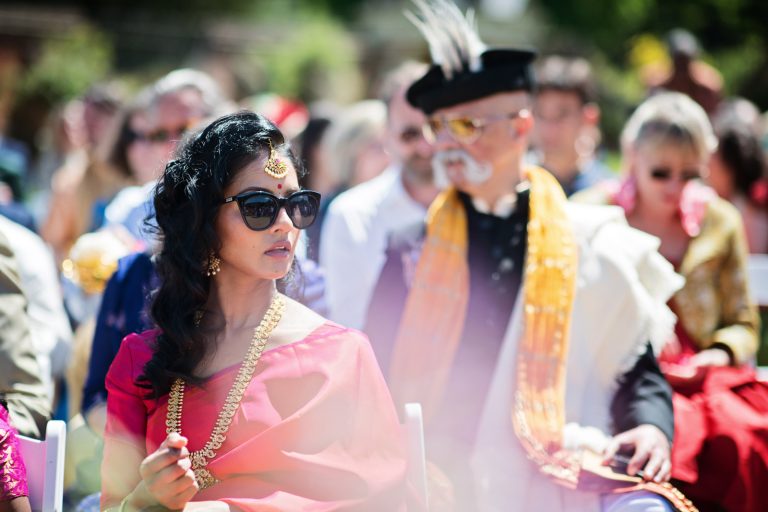 Wedding guest looking fabulous in Indian wedding attire at Hindu ceremony at North Mymms Park, candidly photographed by Blooming Photography.