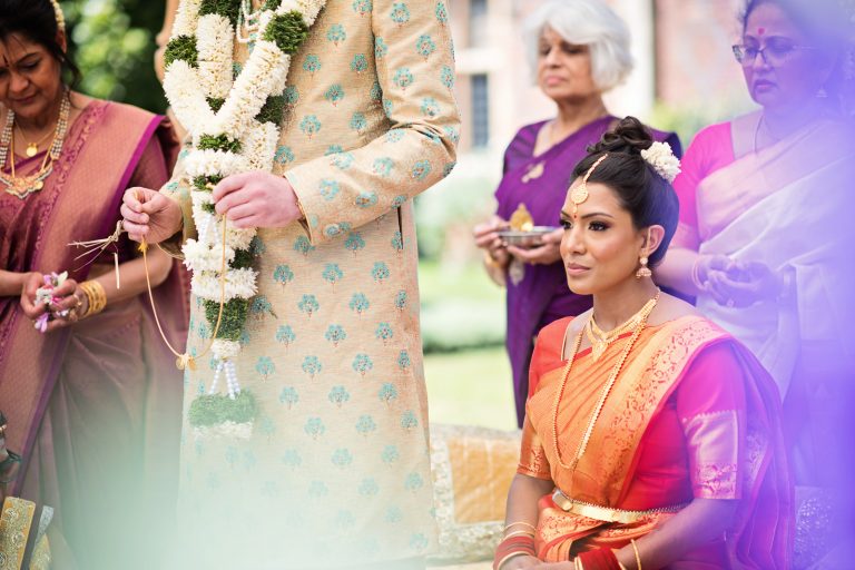 Close up image of bride during Hindu ceremony at North Mymms Park, candidly photographed by Blooming Photography.
