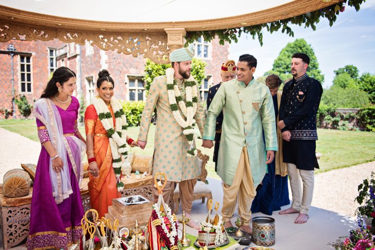 Saptapadi during Hindu ceremony at North Mymms Park, candidly photographed by Blooming Photography.