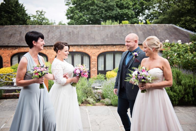 Bride and bride meet before wedding ceremony.