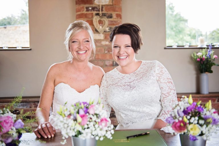 Bride and bride after signing the register.