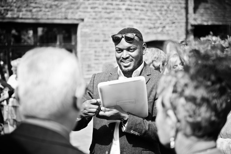 Caricaturist drawing wedding guests.