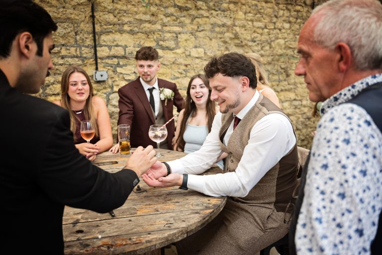 A magician entertaining wedding guests