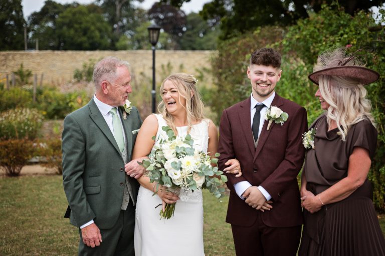 a fun family group photo of people laughing at each other.