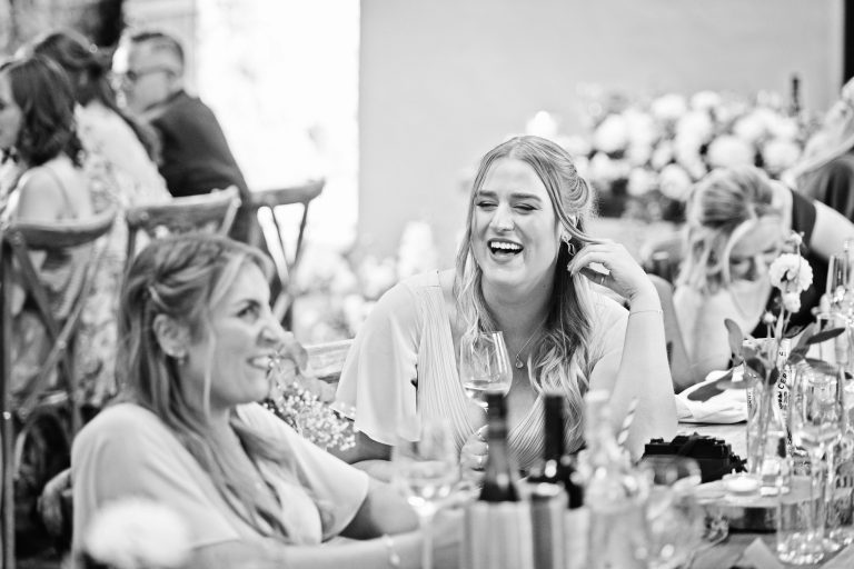 b&w image of bridesmaids laughing together