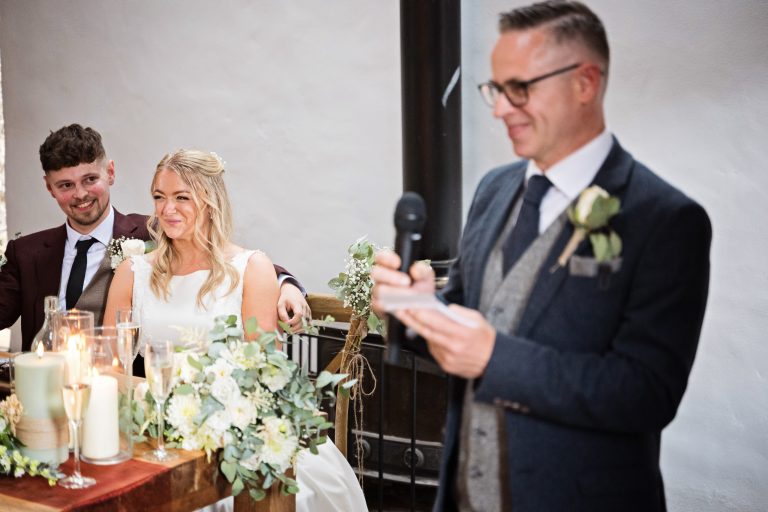 Bride & Groom's reaction to the father of the groom's wedding speech.