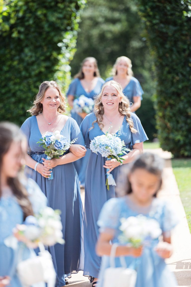 Bridesmaids walking down the wedding isle