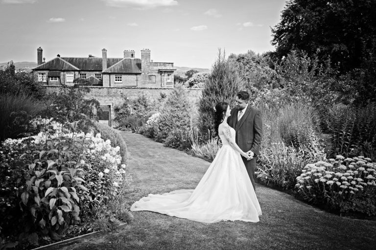 Classic Herefordshire wedding venue, Homme House with bride and groom in the gardens, photography by Blooming Photography