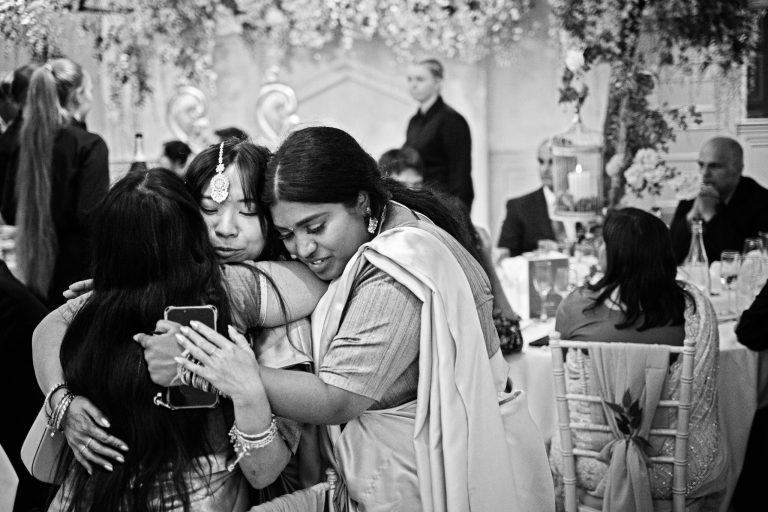 Candid wedding photograph at Manor By The Lake by Blooming Photography