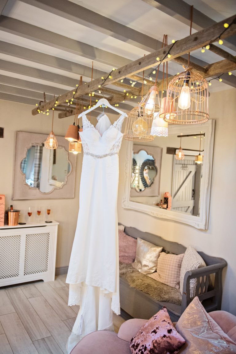 wedding dress that is being hung up in the bridal suite at Blackwell Grange.