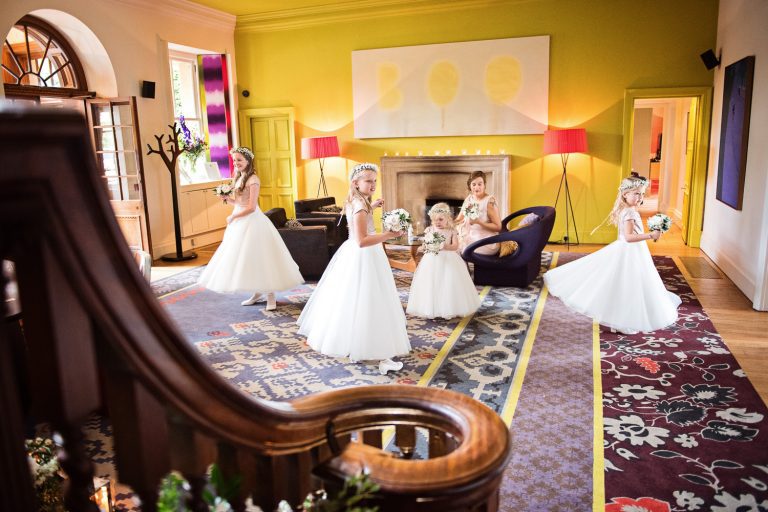 Flower girls spinning in their dresses.