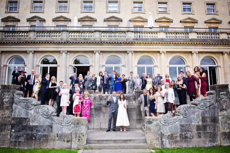 Large group shot of everyone on the terrace at Cowley Manor.