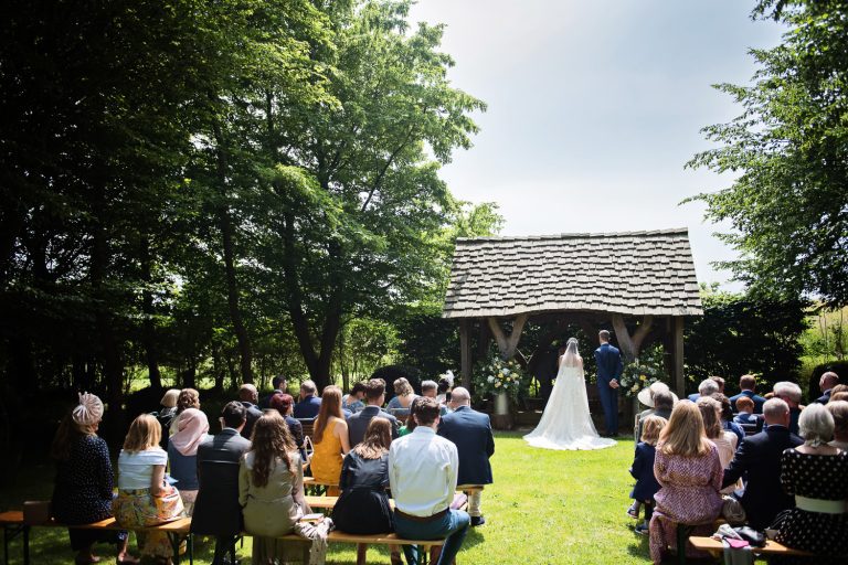 Outdoor wedding ceremony at Cripps Barn.