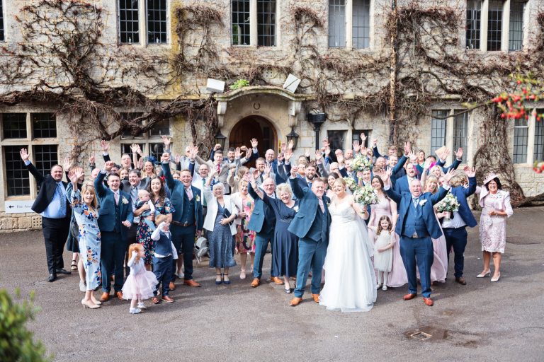 Wedding group shot outside the front of Hatton Court Hotel.