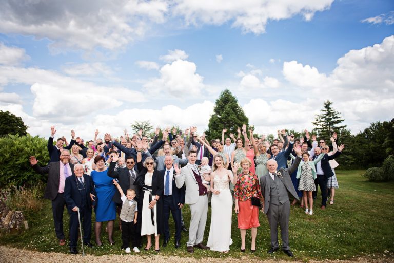 Group shot of everyone with their hands raised in the air like they don't care!