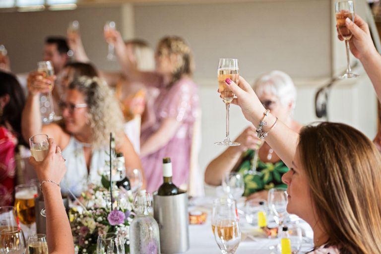 Guests raise a glass in celebration at the end of the speeches.