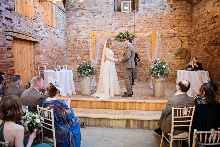 A wedding ceremony in full flow at Milton End Farm.