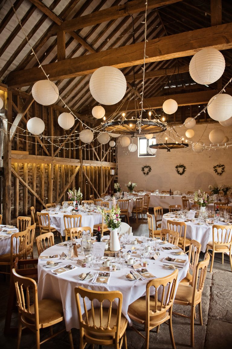 Rustic Wedding breakfast layout in a wedding barn in Gloucestershire.