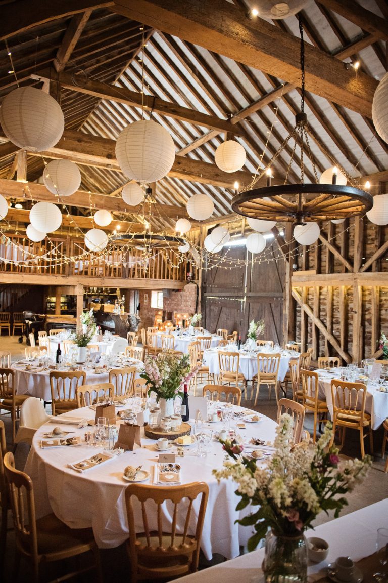 Overview of the inside of Over Barn when laid out for a wedding breakfast.